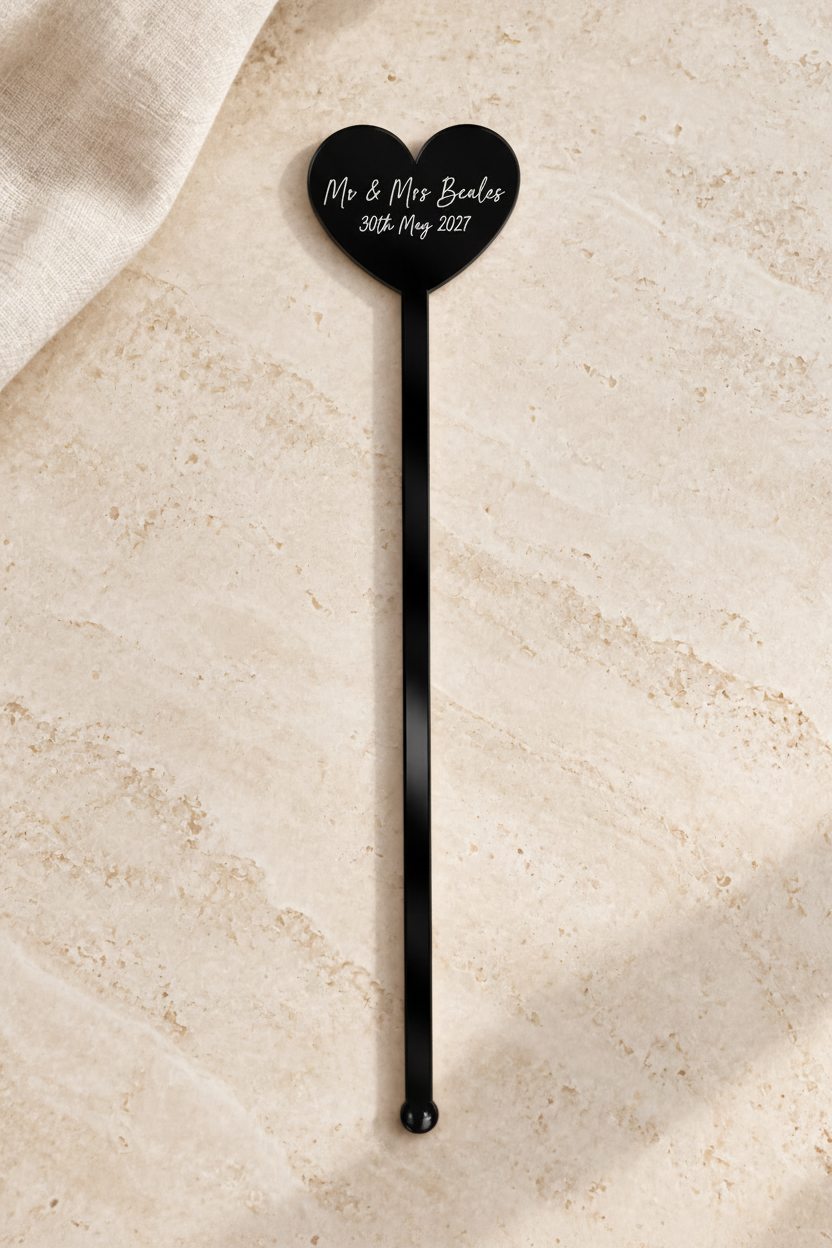Black personalised acrylic heart drink stirrer in portrait format
