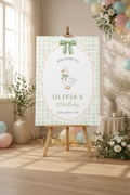 Personalised duck-themed birthday welcome sign displayed on a wooden easel at a children's party